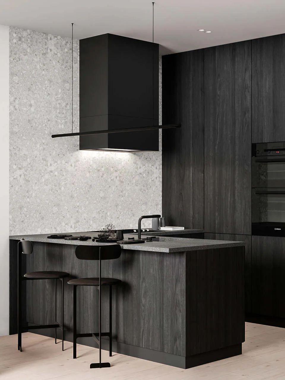 开放式空间又有自我分离,厨房的黑胡桃色橱柜与水磨石墙面形成鲜明